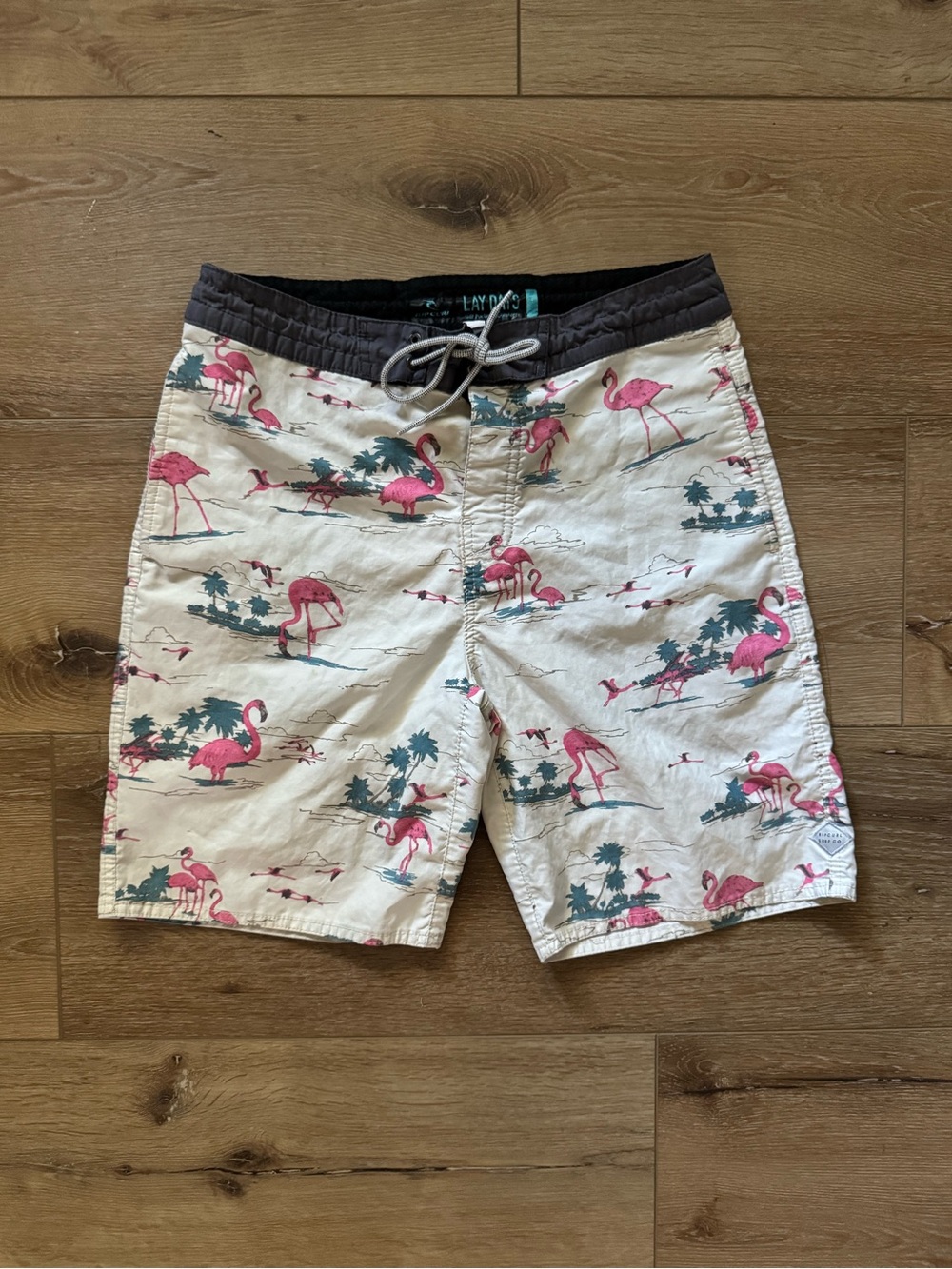 Rip Curl White Swim Shorts with Pink Flamingo Print and Black Waistband